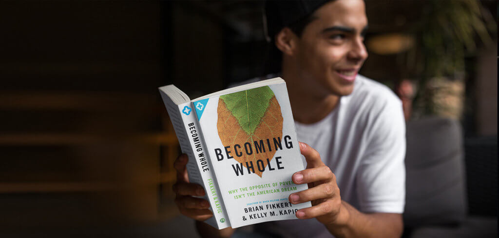 Man reading Becoming Whole