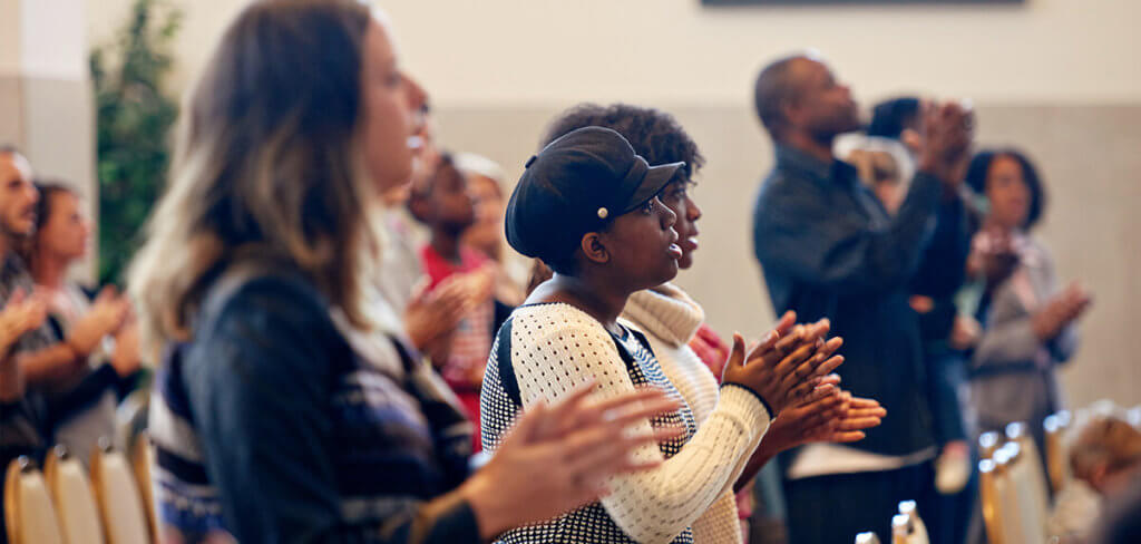 Congregation worshipping in a church
