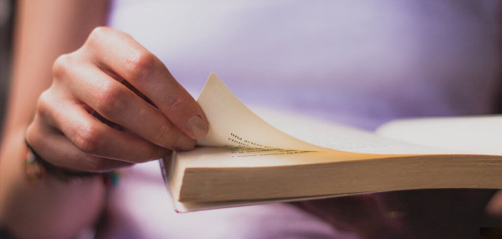 Someone flipping through the pages of a book