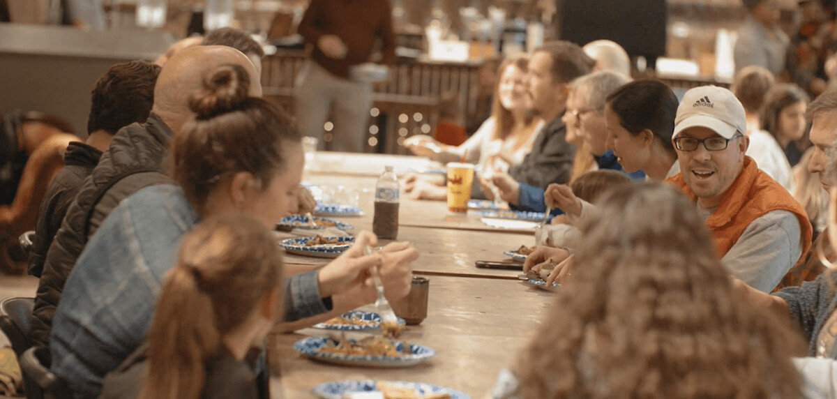 People feasting together at a large table
