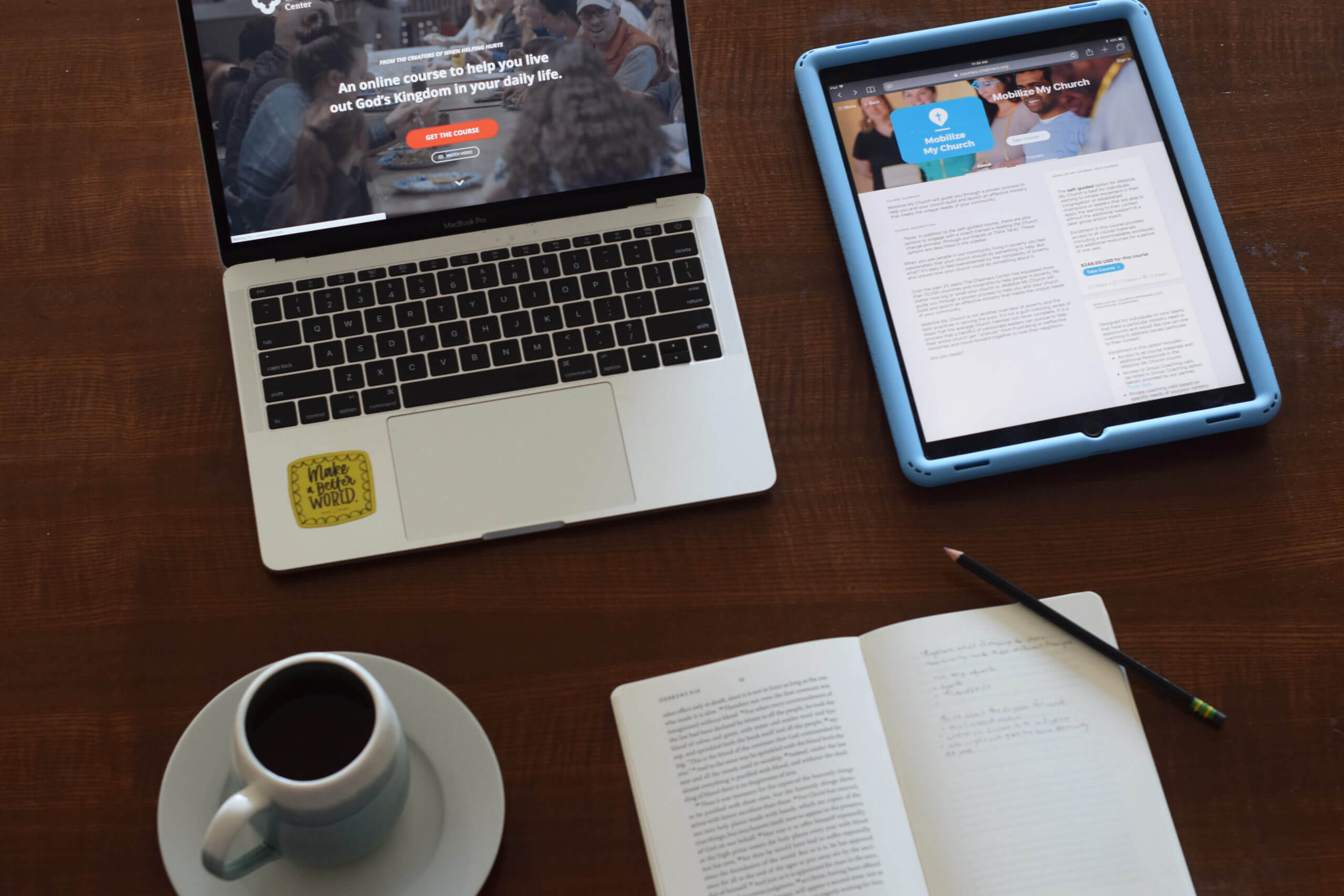 Image of laptop, tablet, book, cup of coffee