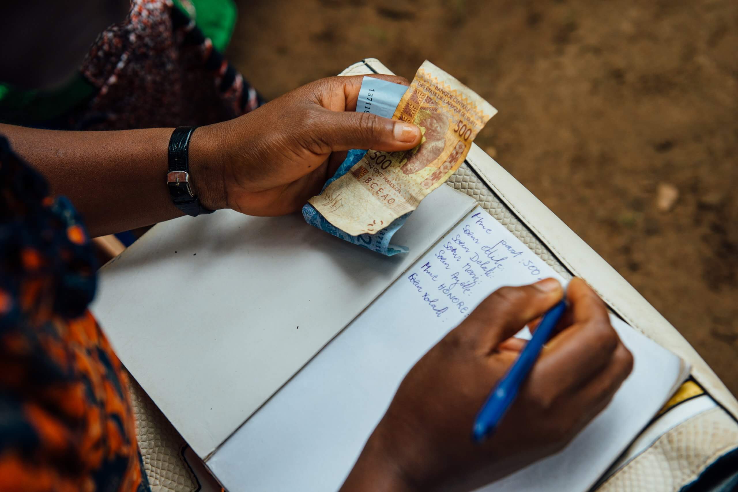 Savings group member counts money