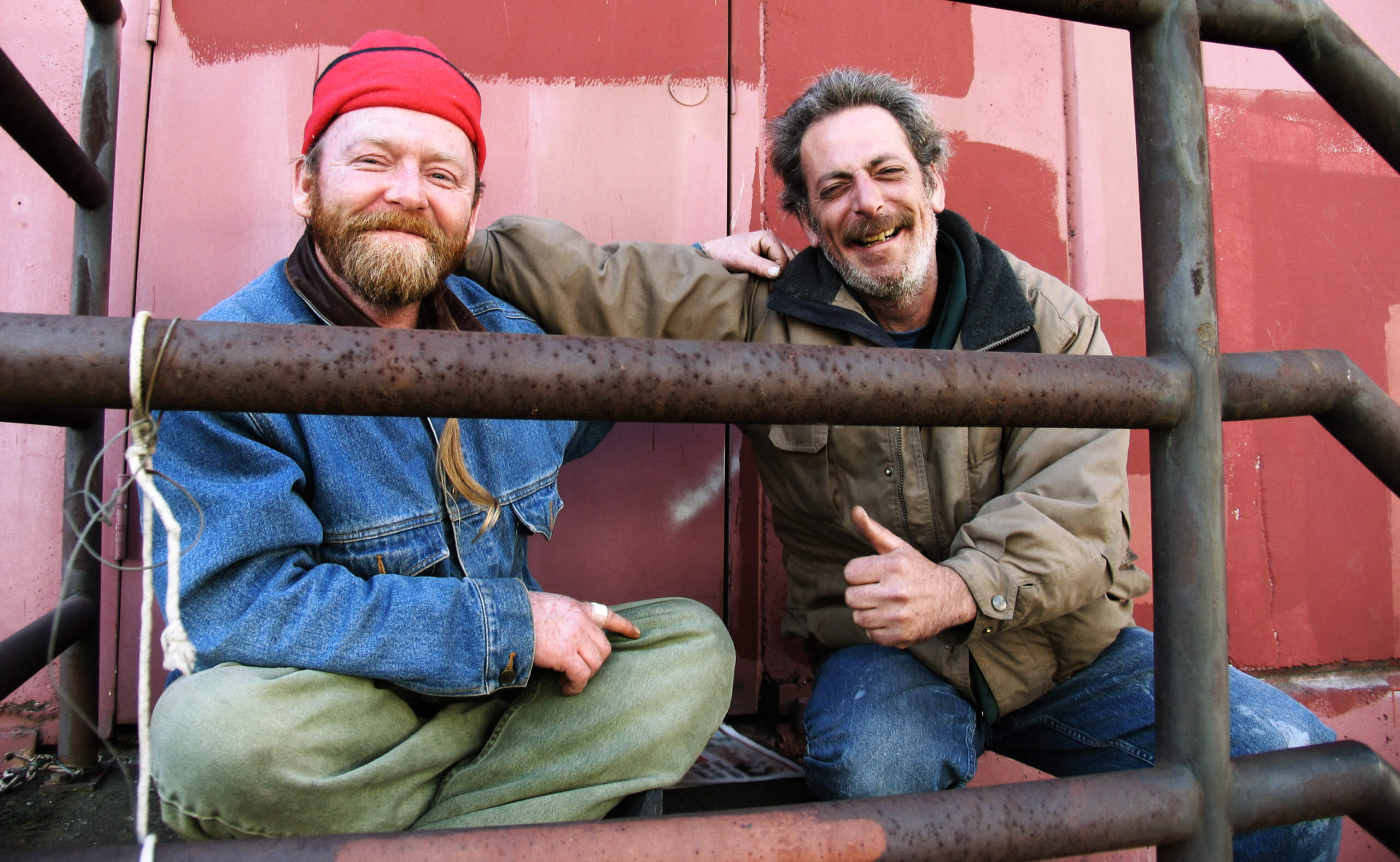 Smiling homeless men